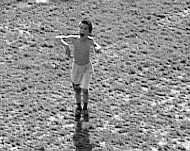 A boy (tries to catch a frisbee), 1999.