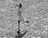 A boy (tries to catch a frisbee), 1999.